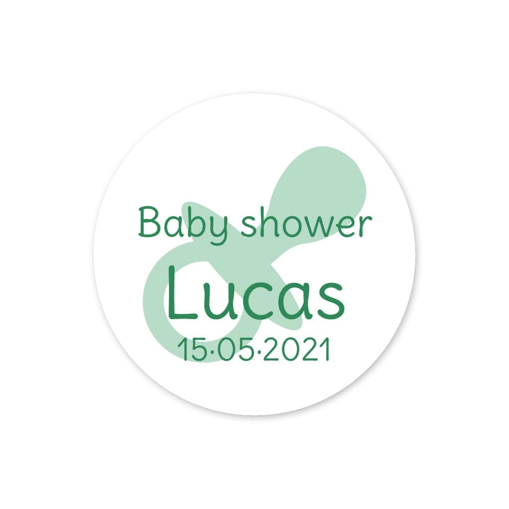 Pegatina detalle con un chupete verde para la fiesta del bebé con el texto Baby Shower